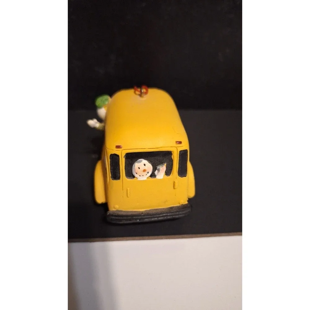 Resin school bus Christmas ornament with Santa and children